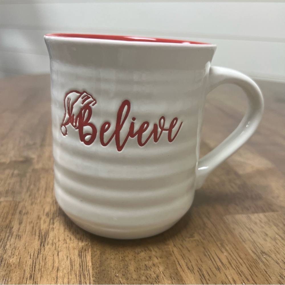 Believe with Santa hat coffee mug.